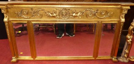 A reproduction gilt composition chimney mirror, having triple bevelled plates and neo-classical