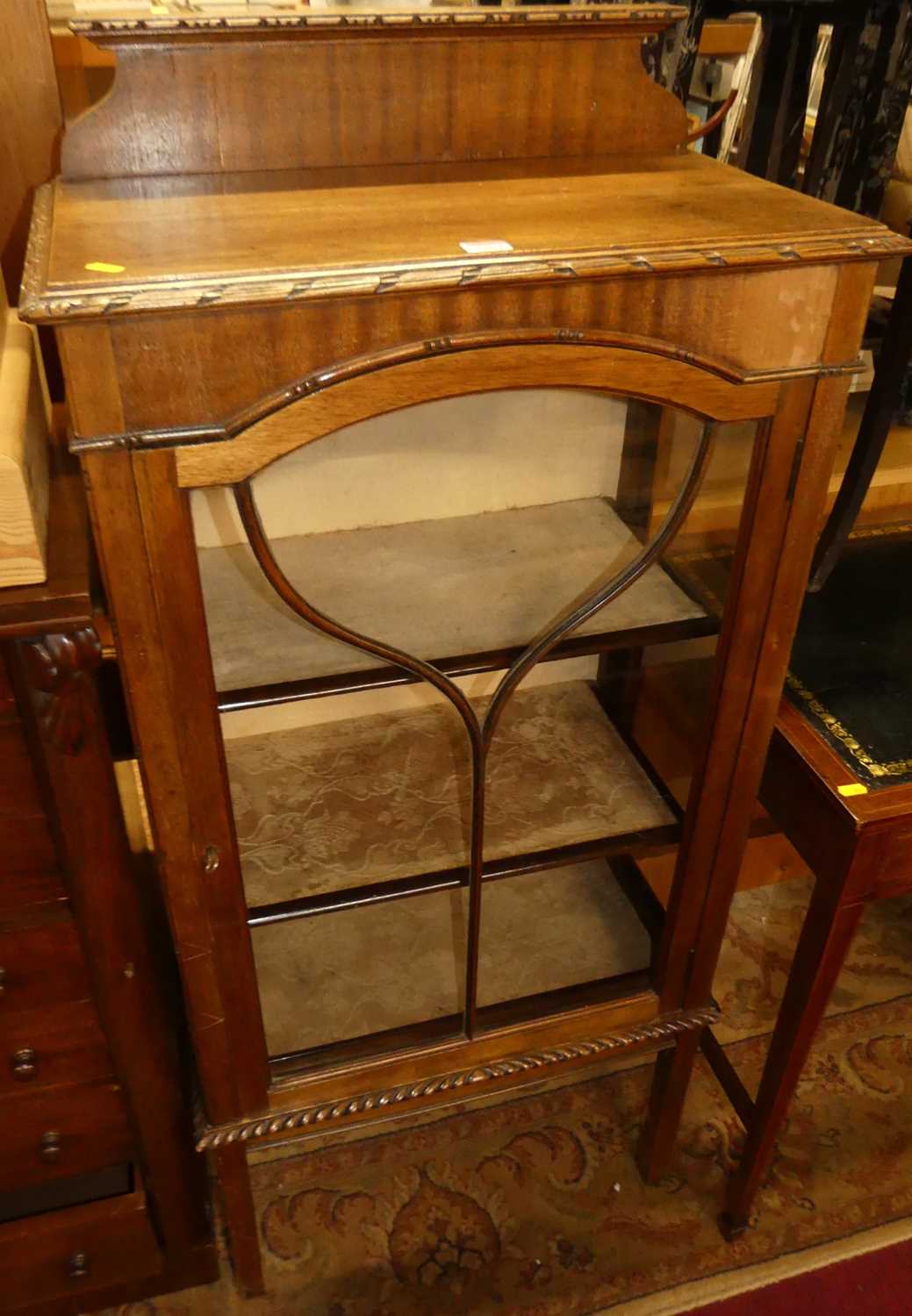 An Edwardian beech ledgeback single door glazed china display cabinet, w.61cm; together with an