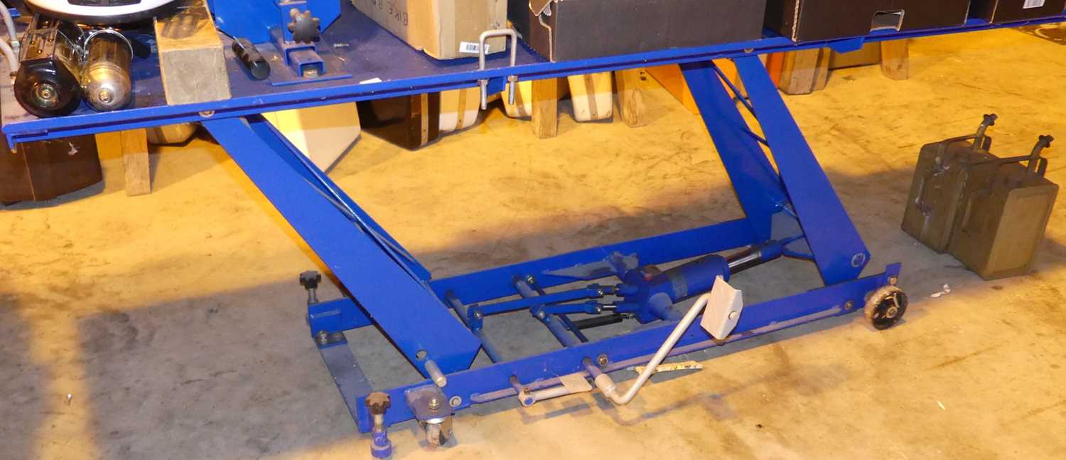 A Silverline motorcycle repair bench, with hydraulic rise-and-fall action, painted in blue enamel