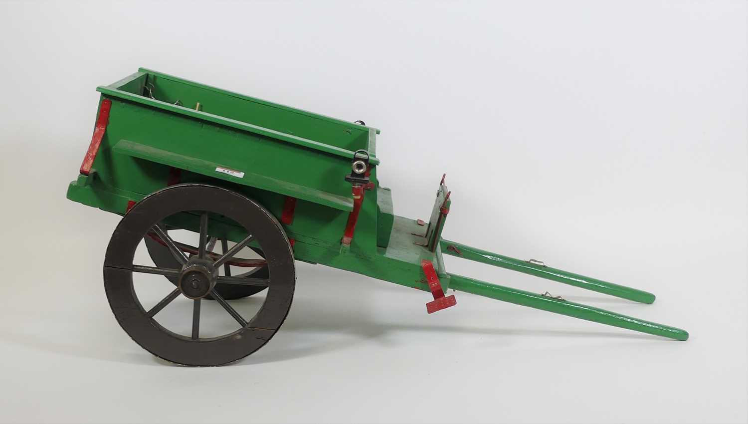 A vintage painted wooden model of a cart, length 77cm