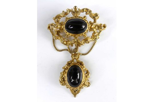 A Victorian style 9ct gold and cabochon onyx set pendant, of chased and pierced oval form, - Image 1 of 4