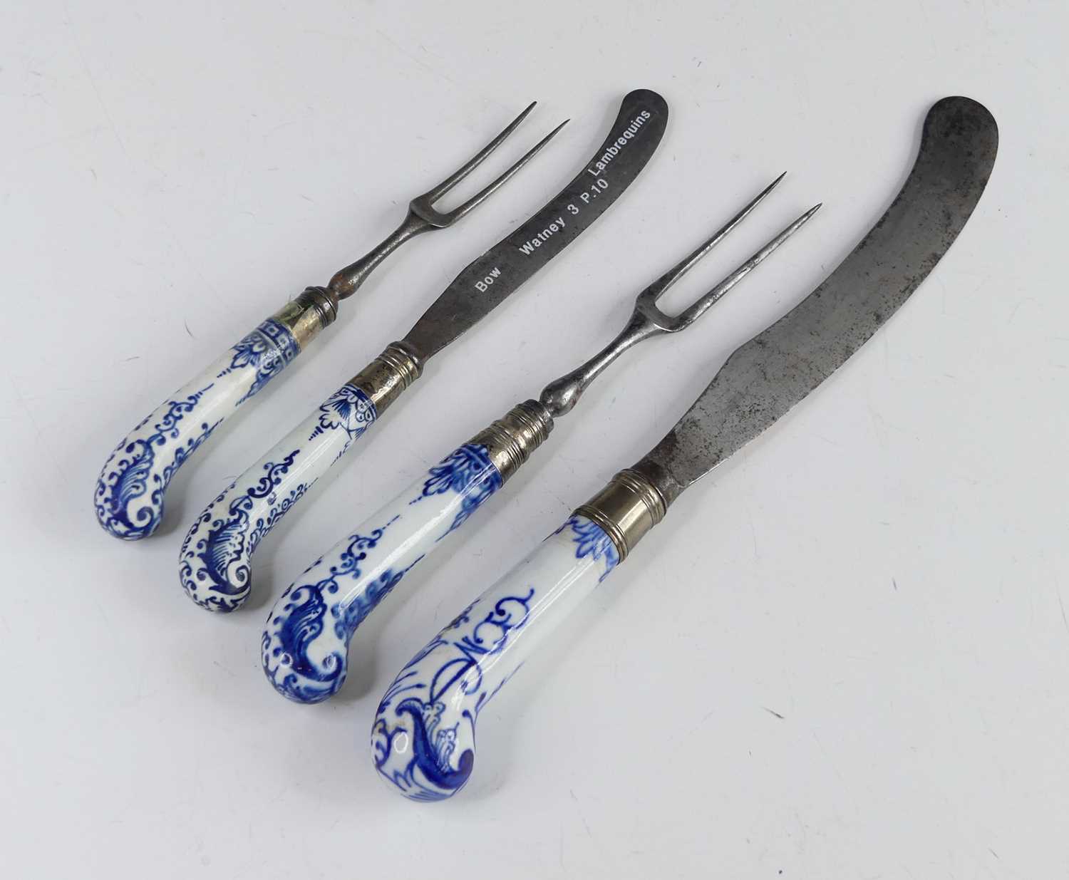 Four Bow blue and white porcelain handled knives and forks, circa 1750, each having a pistol grip