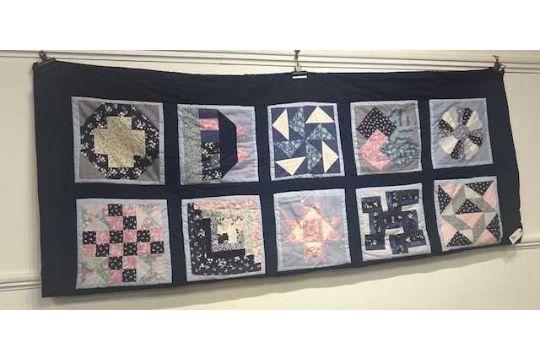 A patchwork quilt, blue background and decorated with geometric shapes, 220 x 180cm - Image 1 of 5