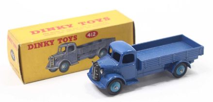 A Dinky Toys No. 412 Austin wagon comprising of dark blue cab and chassis with mid blue hubs housed