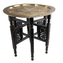 A 1930s Indian brass-topped folding table, 49 x 48 cm
