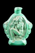 An Art Deco malachite-glass scent bottle, relief-decorated in depiction of a seated nude woman and
