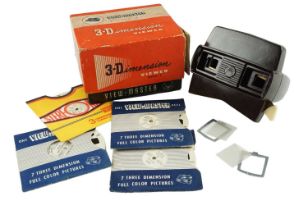 A boxed Sawyer's Bakelite View-Master Model E stereoviewer and a small group of stereographs,