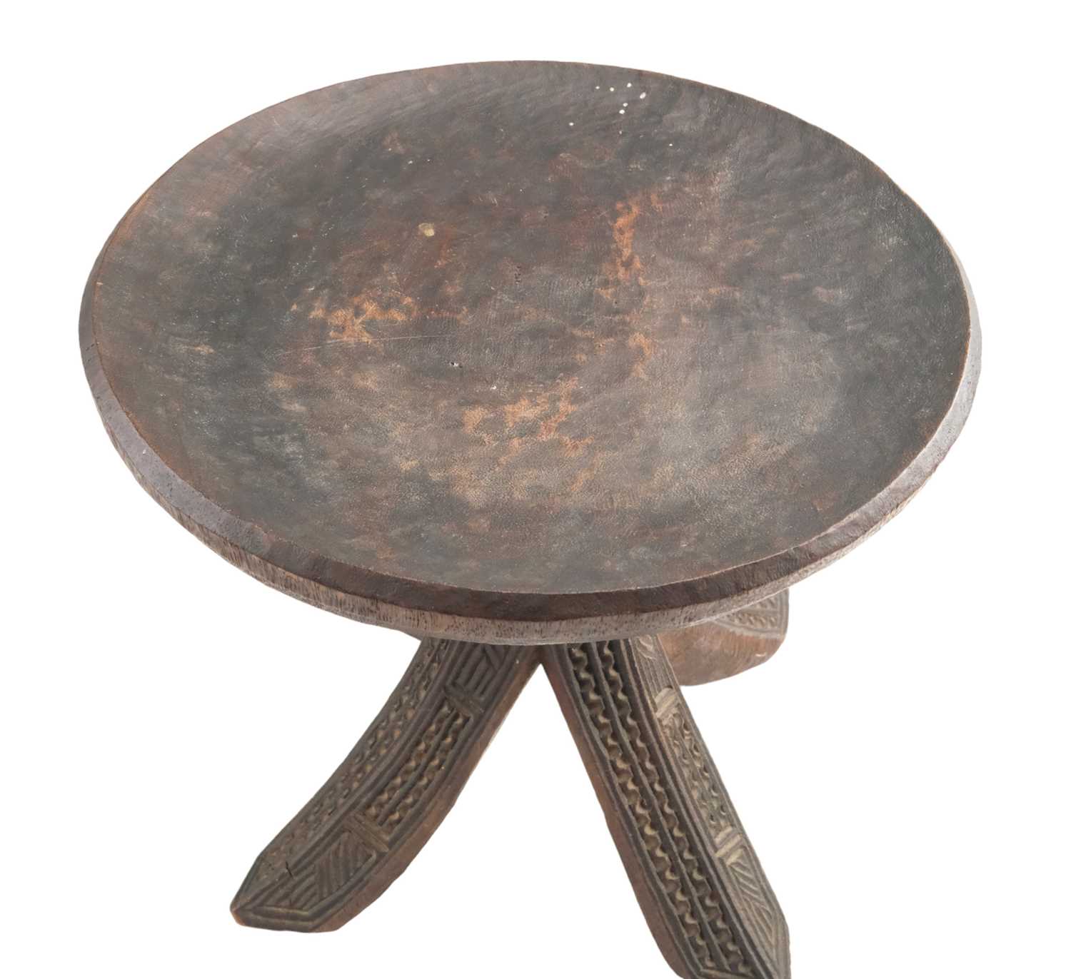 An African carved hardwood stool, having a concave top, carved and raised on a carved four leg - Image 2 of 2