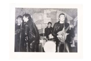 An early photograph of The Beatles at The Cavern Club, Liverpool, from the same source as the