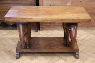 A mid 20th Century African carved mahogany 'elephant' bench / table, having inlaid bone eyes, 88 x