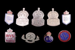 A small collection of Home Front badges including an "SSS On National Service" War worker's badge, a