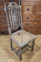 A late 19th / early 20th Century William III style carved oak and cane seated back-stool