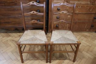 A pair of Victorian rush-seated walnut ladder-back chairs, 90 cm