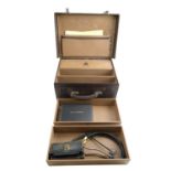 A vintage doctor's case and medical instruments, having a fall-flap enclosing three drawers,