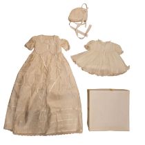 A vintage christening gown, decorated with faux seed pearls, together with a similar Sarah Louise
