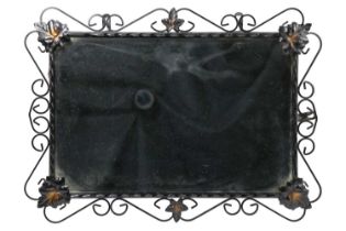 A contemporary wrought metal and foliate decorated wall mirror, plate 28.5 x 44 cm