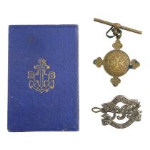 A Boys' Brigade Ambulance certificate, a Sure & Stedfast cap badge and a St Johns Ambulance
