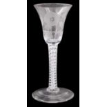 A Jacobite wine glass, having a bell-shaped bowl, the stem having a spiral thread ribbon and