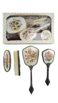 A boxed gilt-metal mounted dressing table set together with an open-work metal mounted brush set,