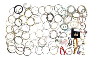 A quantity of costume jewellery bangles, bracelets, earrings and rings