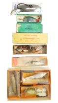 A small group of vintage fishing lures, including a "Red Eye" Wiggler by The Hofschneider Corp, etc