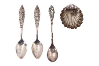 A Victorian silver shell-form salt cellar, together with three commemorative white metal spoons,