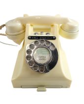 A 1950s / 1960s 300 series ivory rotary dial telephone, marked '314 FTC.54/2A', having a single