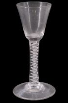 A mid 18th Century opaque twist wine glass, having a conical funnel bowl, its stem having double