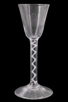 A mid 18th Century opaque twist wine glass, having a conical funnel bowl and single spiral gauze