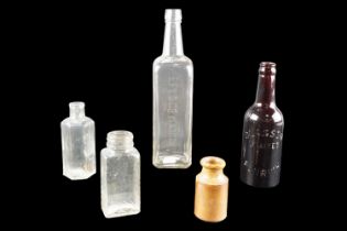Four vintage glass bottles, comprising Glasson Limited of Penrith, Flag Sauce, Lytia Wave Set, and a