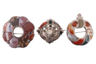 Three Victorian polished hardstone and citrine pebble brooches, comprising a citrine set belt, a