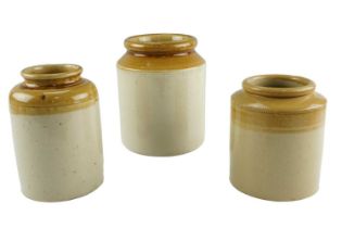 Three antique glazed stoneware storage jars, largest 19.5 cm