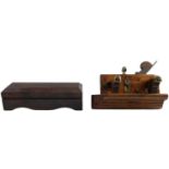 A late 19th / early 20th Century plough plane together with an oilstone in mahogany case