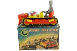A boxed 1950s battery-operated Atomic Bulldozer, having bump-and-go action, by PMC, made in Hong