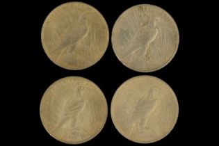 Four silver US "Peace Dollar" one dollar coins, comprising a 1922 (normal relief), 1923, 1925, and