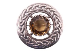 A Scottish silver plaid brooch by Robert Allison, having a 20 mm yellow heliodor set within an