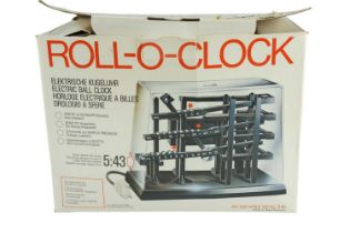 A boxed 1970s German Roll-O-Clock electric ball clock, by Demix, with instruction booklet, 26 x 16 x