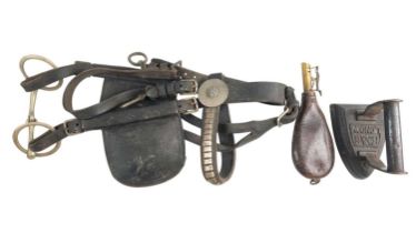 A Victorian leather shot pouch, a sad iron and a horse's head-harness with blinkers
