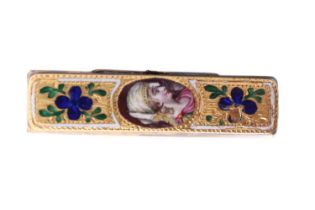 A 19th Century enamelled brooch, the yellow metal front decorated with a portrait and champleve