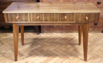 A 1960s - 1970s teak writing table, having three drawers and angled tapering legs, 116 x 50 x 75 cm