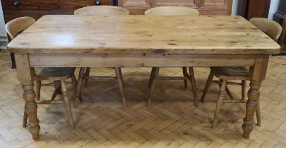 A late 20th Century pine kitchen table and four oak chairs, table 183 x 89 x 79 cm