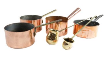 A pair of early 20th Century copper saucepans, a hand-raised copper saucepan having a pouring spout,