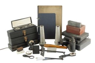 A collection of ophthalmic instruments and equipment, including an ophthalmoscope, a Gowllands and