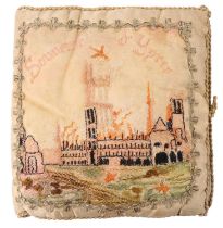 A Great War embroidered silk souvenir of Ypres depicting the Cloth Hall in flames, 17 cm