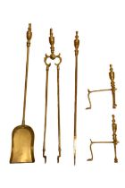 A set of brass hearth implements together with a pair of andirons, 73 cm