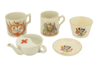 Military and related ceramics including a Red Cross feeding cup, a 17th Lancers Edwardian