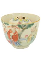 A Chinese trick cup, or Gong Dao Bei, of tapering form, famille rose decorated in depiction of