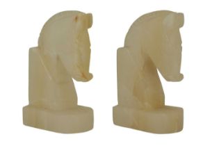 A pair of late 20th Century onyx horsehead bookends, 13 cm