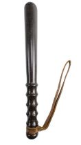 A turned hardwood truncheon, marked CBI to strap, 37 cm long