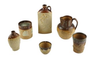 Four items of Doulton sprigged stoneware harvest pattern, comprising a jug, two silver mounted